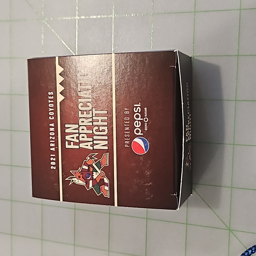 Coyotes hockey puck, certified and signed by Conor Garland.